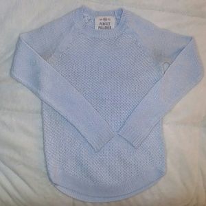 A light blue pullover